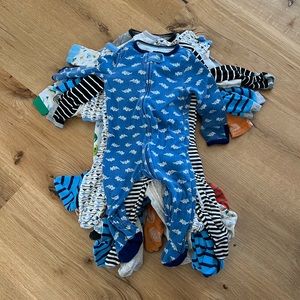 Stack of baby boy 6-9M footie pajamas (12 total)